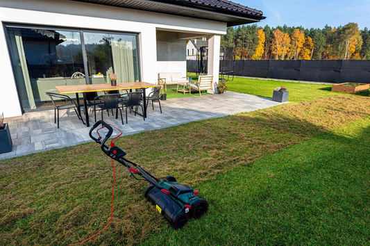 Core Aerator Being Pushed On Lawn