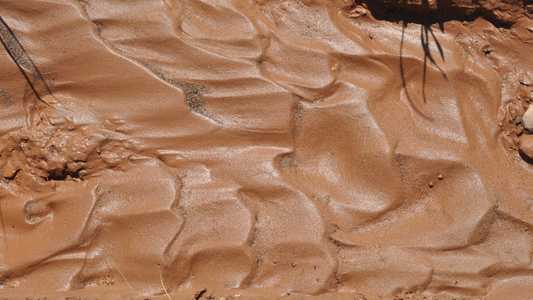 Wet Red Clay Soil Surface Close Up